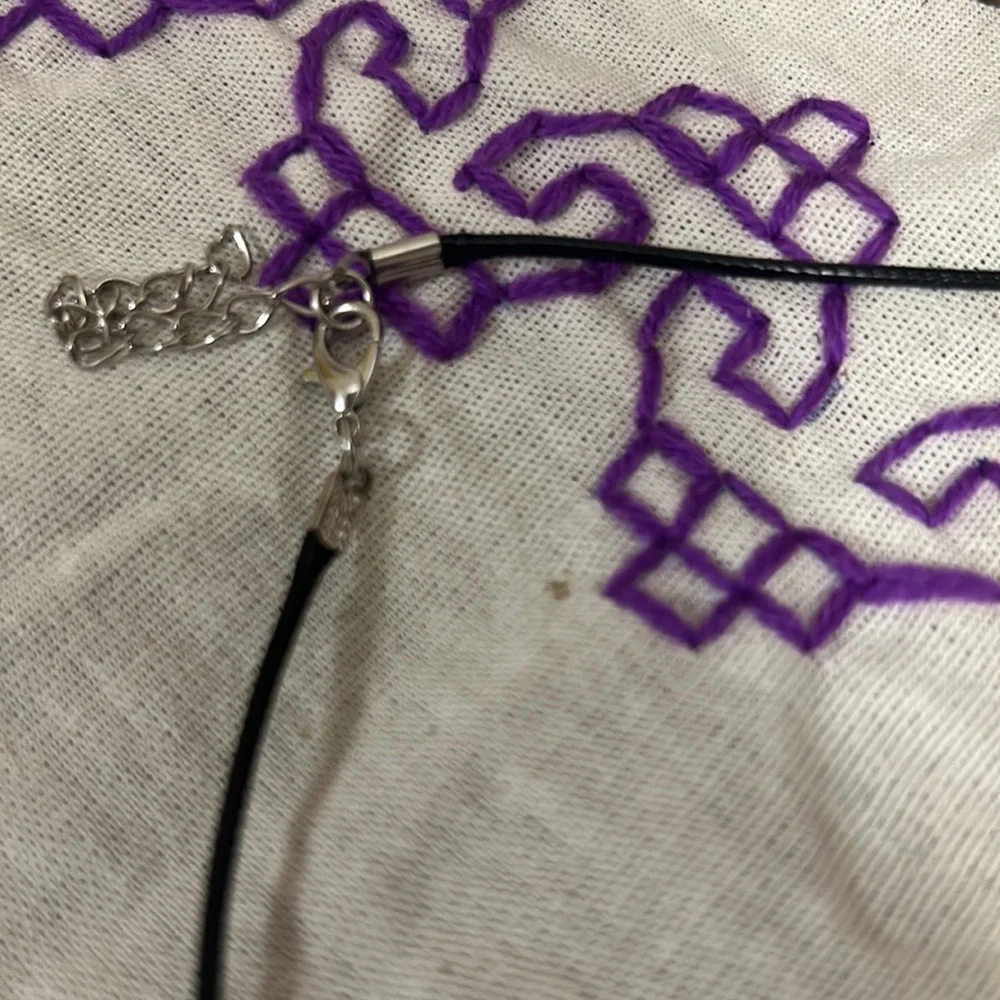 This black stone with white swirls is highly blessed - Picture 3 of 3